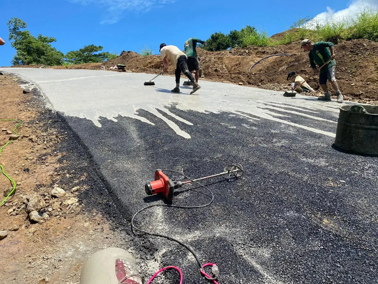 Workers laying a road surface